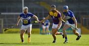 26 June 2021; Jack O'Connor of Wexford in action against Ciaran McEvoy, left, and Stephen Maher of Laois during the Leinster GAA Hurling Senior Championship Quarter-Final match between Wexford and Laois at UPMC Nowlan Park in Kilkenny. Photo by Ray McManus/Sportsfile