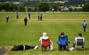 27 June 2021; Leinster Lightning players celebrate a wicket as spectators look on during the Cricket Ireland InterProvincial Trophy 2021 match between North West Warriors and Leinster Lightning at Bready Cricket Club in Magheramason, Tyrone. Photo by Harry Murphy/Sportsfile