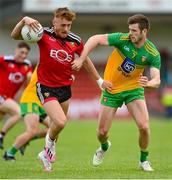 27 June 2021; Liam Kerr of Down in action against Eoghan Ban Gallagher of Donegal during the Ulster GAA Football Senior Championship Preliminary Round match between Down and Donegal at Páirc Esler in Newry, Down. Photo by Ramsey Cardy/Sportsfile