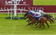 27 June 2021; Atomic Jones, blue and white cap, with Colin Keane up, on their way to winning the Barronstown Stud Irish EBF Maiden, from second place Point Gellibrand, hidden, with Shane Crosse up, and third place Shark Bay, nearside, with Ryan Moore up, during day three of the Dubai Duty Free Irish Derby Festival at The Curragh Racecourse in Kildare. Photo by Seb Daly/Sportsfile
