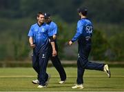 27 June 2021; Josh Little, left, and George Dockrell of Leinster Lightning celebrate the wicket  of Andy McBrine of North West Warriors during the Cricket Ireland InterProvincial Trophy 2021 match between North West Warriors and Leinster Lightning at Bready Cricket Club in Magheramason, Tyrone. Photo by Harry Murphy/Sportsfile