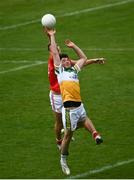 27 June 2021; Eoin Rigney of Offaly in action against Conor Grimes of Offaly during the Leinster GAA Football Senior Championship Round 1 match between Louth and Offaly at Páirc Tailteann in Navan, Meath. Photo by David Fitzgerald/Sportsfile