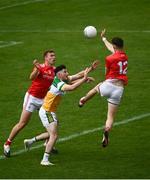 27 June 2021; Eoin Rigney of Offaly in action against Ciaran Downey, right, and Conor Grimes of Offaly during the Leinster GAA Football Senior Championship Round 1 match between Louth and Offaly at Páirc Tailteann in Navan, Meath. Photo by David Fitzgerald/Sportsfile