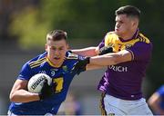 27 June 2021; John Paul Hurley of Wicklow in action against Liam O'Connor of Wexford during the Leinster GAA Football Senior Championship Round 1 match between Wicklow and Wexford at County Grounds in Aughrim, Wicklow. Photo by Piaras Ó Mídheach/Sportsfile
