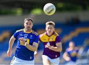 27 June 2021; Seánie Furlong of Wicklow gets away from Martin O'Connor of Wexford during the Leinster GAA Football Senior Championship Round 1 match between Wicklow and Wexford at County Grounds in Aughrim, Wicklow. Photo by Piaras Ó Mídheach/Sportsfile
