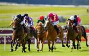 27 June 2021; Thundering Nights, centre, with Shane Crosse up, on their way to winning the Alwasmiyah Pretty Polly Stakes, from second place Santa Barbara, left, with Ryan Moore up, during day three of the Dubai Duty Free Irish Derby Festival at The Curragh Racecourse in Kildare. Photo by Seb Daly/Sportsfile