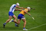27 June 2021; Aron Shanagher of Clare heads goalwards before winning a penalty after being fouled by Shane Fives of Waterford, left, during the Munster GAA Hurling Senior Championship Quarter-Final match between Waterford and Clare at Semple Stadium in Thurles, Tipperary. Photo by Ray McManus/Sportsfile