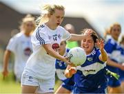 27 June 2021; Neasa Dooley of Kildare in action against Clodagh Dunne of Laois during the Lidl Ladies Football National League Division 3 Final match between Kildare and Laois at Baltinglass GAA Club in Baltinglass, Wicklow. Photo by Matt Browne/Sportsfile