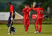 27 June 2021; Matt Ford of Munster Reds celebrates with Seamus Lynch after taking the wicket of Harry Tector of Northern Knights during the Cricket Ireland InterProvincial Trophy 2021 match between Northern Knights and Munster Reds at Bready Cricket Club in Magheramason, Tyrone. Photo by Harry Murphy/Sportsfile