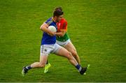 27 June 2021; Robbie Smyth of Longford in action against Josh Moore of Carlow during the Leinster GAA Football Senior Championship Round 1 match between Carlow and Longford at Bord Na Mona O’Connor Park in Tullamore, Offaly. Photo by Eóin Noonan/Sportsfile