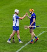 27 June 2021; Clare goalkeeper Eibhear Quilligan and Shane Bennett of Waterford after the Munster GAA Hurling Senior Championship Quarter-Final match between Waterford and Clare at Semple Stadium in Thurles, Tipperary. Photo by Ray McManus/Sportsfile