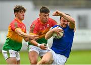 27 June 2021; Donal McElligott of Longford is tackled by Conor Crowley, left, and Colm Hulton of Carlow during the Leinster GAA Football Senior Championship Round 1 match between Carlow and Longford at Bord Na Mona O’Connor Park in Tullamore, Offaly. Photo by Eóin Noonan/Sportsfile