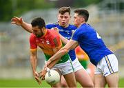 27 June 2021; Chris Blake of Carlow in action against Enda Macken of Longford during the Leinster GAA Football Senior Championship Round 1 match between Carlow and Longford at Bord Na Mona O’Connor Park in Tullamore, Offaly. Photo by Eóin Noonan/Sportsfile