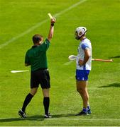 27 June 2021; Shane Fives of Waterford is issued with a yellow card by referee Colm Lyons during the Munster GAA Hurling Senior Championship Quarter-Final match between Waterford and Clare at Semple Stadium in Thurles, Tipperary. Photo by Ray McManus/Sportsfile