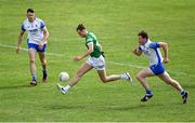 26 June 2021; Brian Donovan of Limerick gets away from Mark Cummins, and Michael Curry of Waterford during the Munster GAA Football Senior Championship Quarter-Final match between Limerick and Waterford at LIT Gaelic Grounds in Limerick. Photo by Piaras Ó Mídheach/Sportsfile