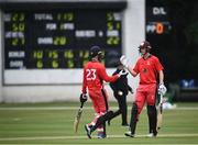 30 June 2021; Murray Cummins of Munster Reds, left, is congratulated by team-mate Jack Carty after hitting 50 runs during the Cricket Ireland InterProvincial Cup 2021 match between Northern Knights and Munster Reds at Bready Cricket Club in Stormont in Belfast. Photo by David Fitzgerald/Sportsfile