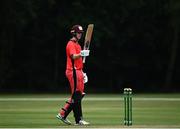 30 June 2021; Jack Carty of Munster Reds celebrates hitting 50 runs during the Cricket Ireland InterProvincial Cup 2021 match between Northern Knights and Munster Reds at Bready Cricket Club in Stormont in Belfast. Photo by David Fitzgerald/Sportsfile