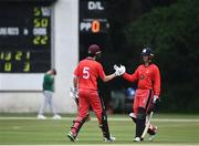 30 June 2021; Jack Carty of Munster Reds, left, is congratulated by team-mate Murray Cummins after hitting 50 runs during the Cricket Ireland InterProvincial Cup 2021 match between Northern Knights and Munster Reds at Bready Cricket Club in Stormont in Belfast. Photo by David Fitzgerald/Sportsfile