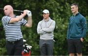 30 June 2021; Rory McIlroy of Northern Ireland, left, and Leinster and Ireland rugby captain Jonathan Sexton watch former Kilkenny hurler DJ Carey on the tee during the Dubai Duty Free Irish Open Golf Championship Pro-Am at Mount Juliet in Thomastown, Kilkenny. Photo by Ramsey Cardy/Sportsfile