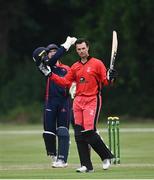 30 June 2021; Murray Cummins of Munster Reds celebrates after hitting a century of runs during the Cricket Ireland InterProvincial Cup 2021 match between Northern Knights and Munster Reds at Bready Cricket Club in Stormont in Belfast. Photo by David Fitzgerald/Sportsfile