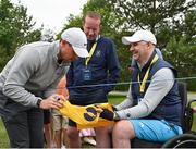 30 June 2021; Rory McIlroy of Northern Ireland signs an autograph for spectator Ian Simpson after the Dubai Duty Free Irish Open Golf Championship Pro-Am at Mount Juliet in Thomastown, Kilkenny. Photo by Ramsey Cardy/Sportsfile