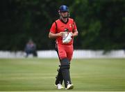 30 June 2021; Fionn Hand of Munster Reds leaves the field after being bowled out during the Cricket Ireland InterProvincial Cup 2021 match between Northern Knights and Munster Reds at Bready Cricket Club in Stormont in Belfast. Photo by David Fitzgerald/Sportsfile