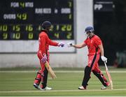 30 June 2021; Matt Ford of Munster Reds, right, and Seamus Lynch fist bump during the Cricket Ireland InterProvincial Cup 2021 match between Northern Knights and Munster Reds at Bready Cricket Club in Stormont in Belfast. Photo by David Fitzgerald/Sportsfile
