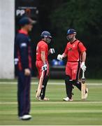 30 June 2021; Matt Ford of Munster Reds, left, and Fionn Hand fist bump during the Cricket Ireland InterProvincial Cup 2021 match between Northern Knights and Munster Reds at Bready Cricket Club in Stormont in Belfast. Photo by David Fitzgerald/Sportsfile