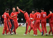 30 June 2021; Munster Reds players celebrate taking the wicket of Paul Stirling during the Cricket Ireland InterProvincial Cup 2021 match between Northern Knights and Munster Reds at Bready Cricket Club in Stormont in Belfast. Photo by David Fitzgerald/Sportsfile