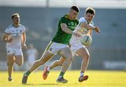 30 June 2021; Eoghan Frayne of Meath in action against John Furlong of Offaly during the Electric Ireland Leinster GAA Football Minor Championship Final match between Meath and Offaly at TEG Cusack Park in Mullingar, Westmeath. Photo by Matt Browne/Sportsfile