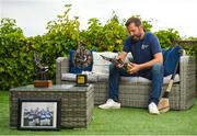 1 July 2021; Ken McGrath pictured at home with some stand-out medals and awards from his career. Ken is helping to launch the Bord Gáis Energy GAA Legends Tour Series for 2021. The tours start online on Wednesday, 7 July continuing weekly for eight weeks, and can be viewed on Bord Gáis Energy Rewards page - bordgaisenergy.ie/my-rewards.  Photo by Seb Daly/Sportsfile