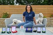 1 July 2021; Noelle Healy pictured at home with her dogs Rory, left, and Luna, and some stand-out medals and awards from her career. Noelle was helping to launch the Bord Gáis Energy GAA Legends Tour Series for 2021. The tours start online on Wednesday, 7 July continuing weekly for eight weeks, and can be viewed on Bord Gáis Energy Rewards page - bordgaisenergy.ie/my-rewards. Photo by Brendan Moran/Sportsfile