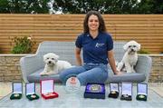 1 July 2021; Noelle Healy pictured at home with her dogs Rory, left, and Luna, and some stand-out medals and awards from her career. Noelle was helping to launch the Bord Gáis Energy GAA Legends Tour Series for 2021. The tours start online on Wednesday, 7 July continuing weekly for eight weeks, and can be viewed on Bord Gáis Energy Rewards page - bordgaisenergy.ie/my-rewards. Photo by Brendan Moran/Sportsfile