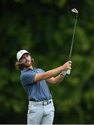 1 July 2021; Tommy Fleetwood of England watches his second shot on the first hole during day one of the Dubai Duty Free Irish Open Golf Championship at Mount Juliet Golf Club in Thomastown, Kilkenny. Photo by Ramsey Cardy/Sportsfile