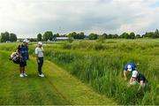 1 July 2021; Course officials look for Rory McIlroy of Northern Ireland's ball on the 17th hole during day one of the Dubai Duty Free Irish Open Golf Championship at Mount Juliet Golf Club in Thomastown, Kilkenny. Photo by Ramsey Cardy/Sportsfile