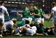 1 July 2021; Ireland players celebrate as team-mate Eoin de Buitlear crosses the line to score a try during the U20 Guinness Six Nations Rugby Championship match between Ireland and England at Cardiff Arms Park in Cardiff, Wales. Photo by Chris Fairweather/Sportsfile