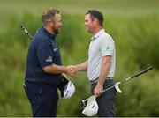 2 July 2021; Shane Lowry of Ireland, left, and Jonathan Caldwell of Northern Ireland shake hands after their round on day two of the Dubai Duty Free Irish Open Golf Championship at Mount Juliet Golf Club in Thomastown, Kilkenny. Photo by Ramsey Cardy/Sportsfile