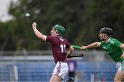 2 July 2021; Ruben Davitt of Galway in action against Ronan Lyons of Limerick during the 2020 Electric Ireland Leinster GAA Hurling Minor Championship Semi-Final match between Limerick and Galway at Cusack Park in Ennis, Clare. Photo by Matt Browne/Sportsfile