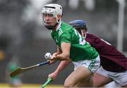 2 July 2021; Adam Fitzgerald of Limerick in action against Liam Leen of Galway during the 2020 Electric Ireland Leinster GAA Hurling Minor Championship Semi-Final match between Limerick and Galway at Cusack Park in Ennis, Clare. Photo by Matt Browne/Sportsfile