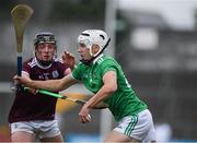 2 July 2021; Adam Fitzgerald of Limerick in action against Liam Leen of Galway during the 2020 Electric Ireland Leinster GAA Hurling Minor Championship Semi-Final match between Limerick and Galway at Cusack Park in Ennis, Clare. Photo by Matt Browne/Sportsfile