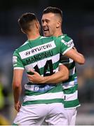 2 July 2021; Aaron Greene of Shamrock Rovers celebrates after scoring his side's third goal with team-mate Danny Mandroiu, left, during the SSE Airtricity League Premier Division match between Shamrock Rovers and Dundalk at Tallaght Stadium in Dublin. Photo by Stephen McCarthy/Sportsfile