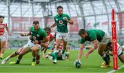 3 July 2021; Stuart McCloskey of Ireland scores his side's second try despite the tackle of Kotaro Matsushima of Japan during the International Rugby Friendly match between Ireland and Japan at Aviva Stadium in Dublin. Photo by Brendan Moran/Sportsfile