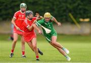 3 July 2021; Sophie O'Callaghan of Limerick in action against Laura Treacy of Cork during the Munster Senior Camogie Final match between Cork and Limerick at Drom & Inch GAA in Tipperary. Photo by Matt Browne/Sportsfile