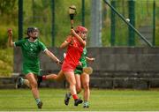 3 July 2021; Fiona Keating of Cork in action against Judith Mulcahy and Muireann Creamer of Limerick during the Munster Senior Camogie Final match between Cork and Limerick at Drom & Inch GAA in Tipperary.  Photo by Matt Browne/Sportsfile
