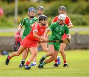 3 July 2021; Saoirse McCarthy of Cork in action against Megan O'Mara of Limerick during the Munster Senior Camogie Final match between Cork and Limerick at Drom & Inch GAA in Tipperary.  Photo by Matt Browne/Sportsfile