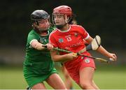 3 July 2021; Fiona Keating of Cork in action against Niamh Ryan of Limerick during the Munster Senior Camogie Final match between Cork and Limerick at Drom & Inch GAA in Tipperary.  Photo by Matt Browne/Sportsfile