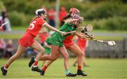 3 July 2021; Roisin Ambrose of Limerick in action against Hannah O'Leary and Fiona Keating of Cork during the Munster Senior Camogie Final match between Cork and Limerick at Drom & Inch GAA in Tipperary. Photo by Matt Browne/Sportsfile