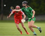 3 July 2021; Judith Mulcahy of Limerick in action against Katrina Mackey of Cork during the Munster Senior Camogie Final match between Cork and Limerick at Drom & Inch GAA in Tipperary. Photo by Matt Browne/Sportsfile