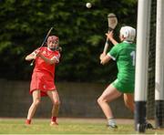 3 July 2021; Katrina Mackey of Cork scores the third goal past Limerick goalkeeper Laura O'Neill during the Munster Senior Camogie Final match between Cork and Limerick at Drom & Inch GAA in Tipperary.  Photo by Matt Browne/Sportsfile