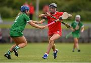 3 July 2021; Ashling Thompson of Cork in action against Marian Quaid of Limerick during the Munster Senior Camogie Final match between Cork and Limerick at Drom & Inch GAA in Tipperary.  Photo by Matt Browne/Sportsfile